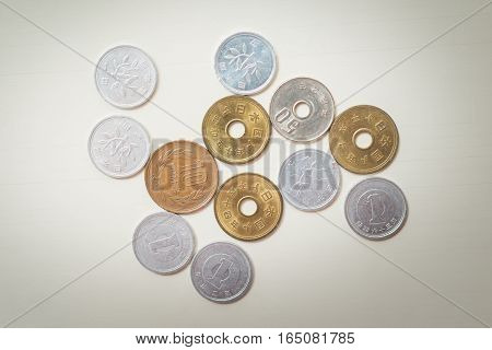 Japanese coins on white table on background