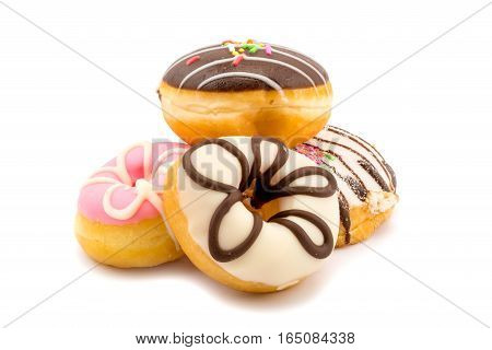 Pile of assorted homemade tasty donuts on white background