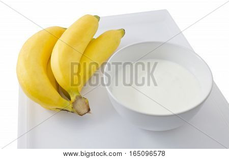 Bowl of Homemade Yoghurt with Ripe Organic Banana Nutritionally Rich in Protein Calcium Riboflavin Vitamin B6 and Vitamin B12.