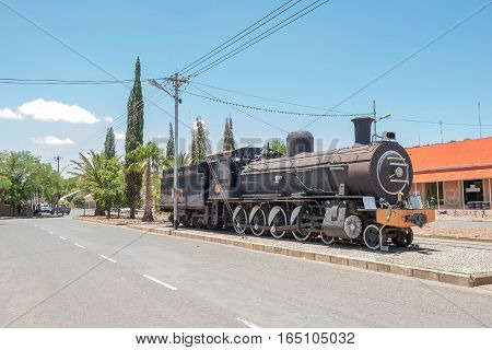 FAURESMITH SOUTH AFRICA - DECEMBER 31 2016: A steam locomotive in Fauresmith one of only three towns on earth where the railway line runs down the centre of the main road