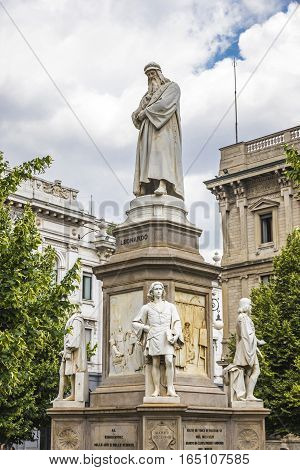 Monument to Leonardo Da Vinci on Piazza Della Scala in Milan Italy. Built in 1872 sculptor Pietro Magni. Statue of Leonardo on a pedestal. At the foot of pedestal stand his four favorite students