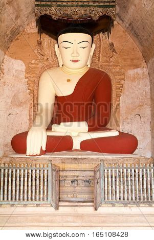 Buddha statue on the temple of Dhammayangyi at Bagan on Myanmar