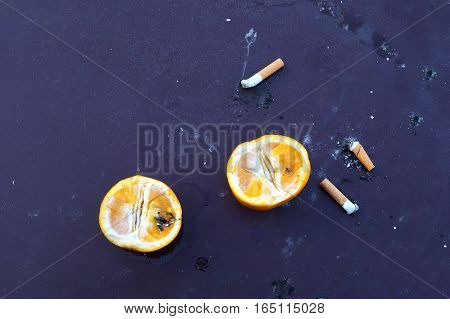 Many cigarette smoked in the crowd, in many countries, smoking is prohibited and encourages a healthy lifestyle and cessation of smoking