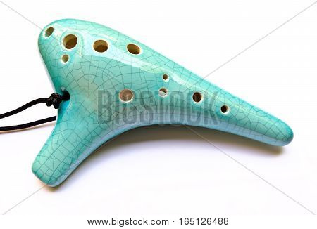 The blue Ocarina isolated on white background