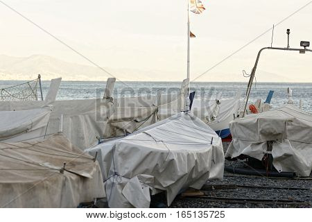 detail of same boats in a beach in arenzano