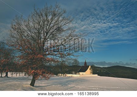 Winter landscape with a beautiful chapel near castle Veveri. Czech Republic city of Brno. The Chapel of the Mother of God.