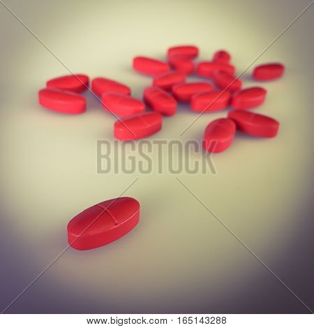Red pills on gray background and shadow vintage stye color.