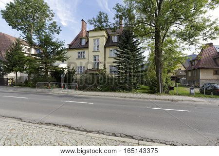 ZAKOPANE POLAND - SEPTEMBER 23 2016: Villa built with bricks and plastered is called Opolanka and was built in 1930. The building houses a museum of Kornel Makuszynski