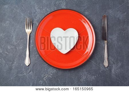 Valentines day background with heart shape plate. Restaurant dinner or menu concept. View from above