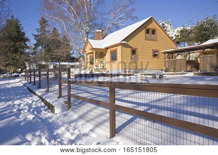 Family home and snow covered ground Gresham Oregon.