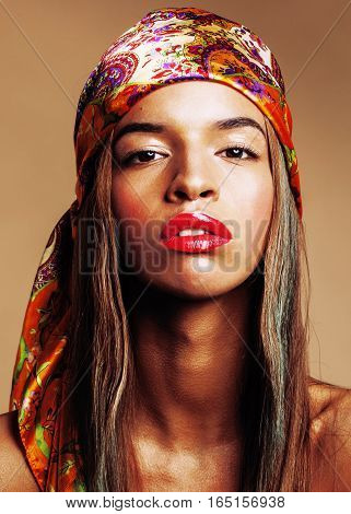 beauty young afro american woman in shawl on head smiling close up swag