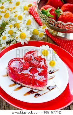 Strawberry heart cake dessert on Valentines Day classic Valentines Day heart-shaped cake with fresh strawberries in jelly gluten-free dessert