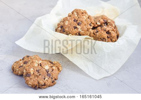 Flourless gluten free peanut butter oatmeal and chocolate chips cookies on cooling rack horizontal