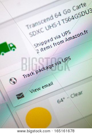 LONDON UNITED KINGDOM - OCTOBER 20 2014: Shipped via UPS 2 items from Amazon text on computer screen with the optiion to track the parcels and view email.
