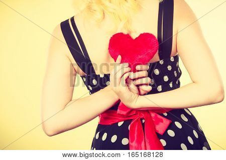 Woman In Dotted Dress Holding Red Heart