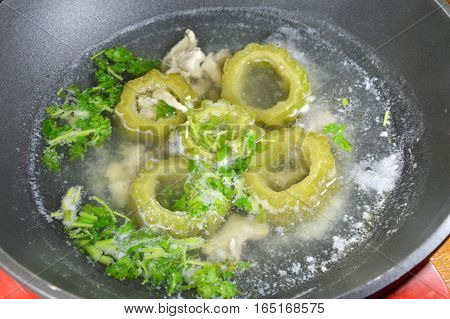 boiled bitter cucumber in electric hot pot