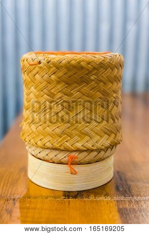 handmade wicker sticky rice on wooden table