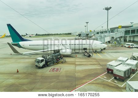 airplane stay on airport for wait passenger - can use to display or montage on product