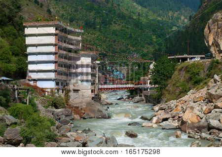 MANIKARAN, INDIA - MAY 13, 2011: Hotel for Sikh pilgrims over the mountain Parvati river in Manikaran. The State Of Himachal Pradesh, North India