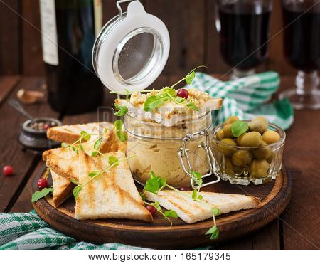 Pate Chicken - Rillette, Toast, Olives And Herbs On A Wooden Board