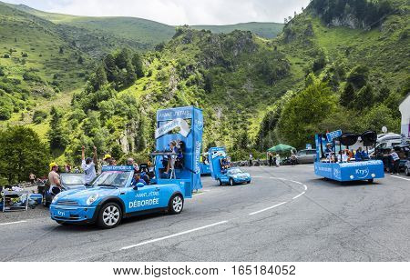 Col du Tourmalet, France - July 24, 2014: Krys caravan during the passing of the Publicity Caravan on the road to Col de Tourmalet in the stage 18 of Le Tour de France 2014.