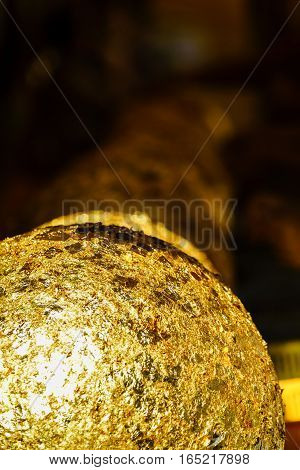 Gold Foil Leaf On Circle Stone In Buddhist Temple Thailand