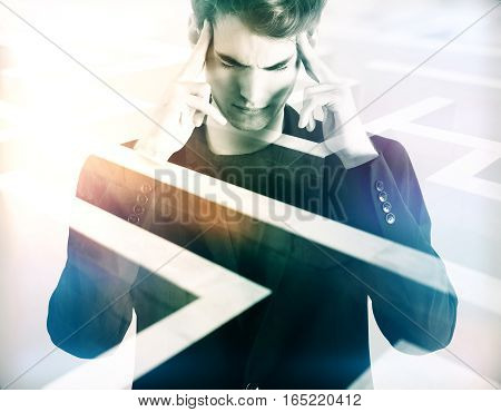 Pensive young businessman on abstract maze background. Business challenge concept. Double exposure