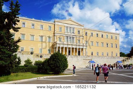 ATHENS - SEPTEMBER 9: People walk around the Greece parliament on Syntagma square on summer sunny day on the 9th of September, 2016 in Athens.