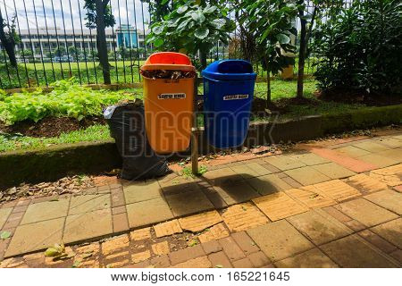 Organic and unorganic trash bin in pedestrian photo taken in Jakarta Indonesia java
