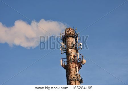 heating smoke pipe CHP blue sky background support