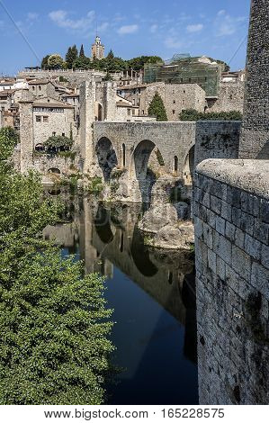Spain Catalonia Girona Besalu. The first mention of the castle Besalu around which the town was formed refer to the tenth century . Castle towers over the hill where lie since the early Middle Ages the remains of Saint Mary .