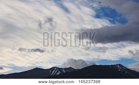 DEQIN CHINA - APRIL 2015 : Cloud moving above the snow mountains
