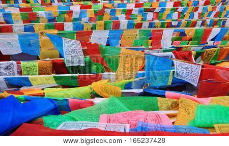 DEQIN CHINA - APRIL 2015 Coloful prayer flag in top of snow mountain at Deqin Yunnan China
