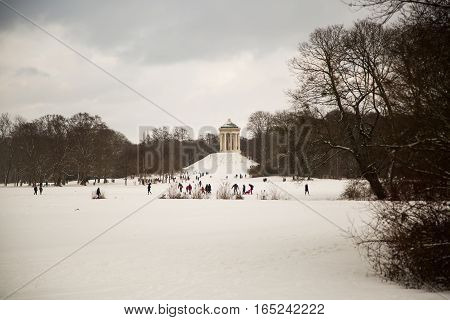 english garden in munich with monopteros, in winter