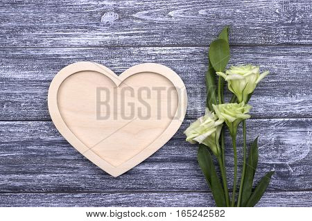 Valentines day card concept with white wooden heart and natural white flowers. Love. Wedding.