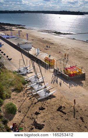 Group of catamarans and kayaks after ocean sailing on beach Bon Secours in Saint-Malo, Bretagne France