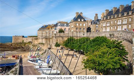 The buildings, catamarans and boats on beach Bon Secours in Saint-Malo, Bretagne, France