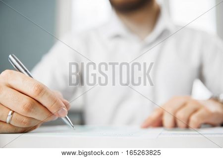 Business person analyzing financial statistics displayed on the tablet