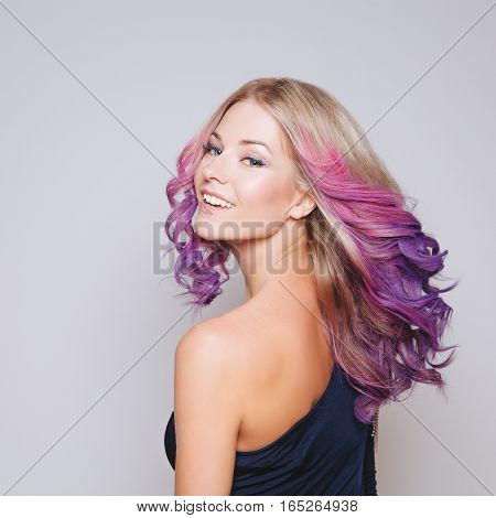 Colored hairs. Portrait of smiling women with flying hairs. Ombre. Gradient. Studio