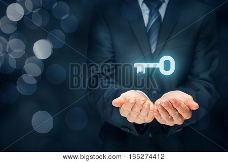 Businessman (consultant, coach, leader, customer service, CEO or another business person) offer key to success or solution. Turnkey solution and services concept. Right composition with bokeh in background.