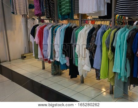 Men's clothes hanging on the rack display photo taken in Jakarta Indonesia java