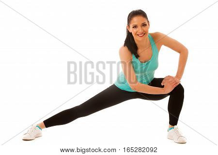 Beautiful Young Hispanic Woman Doing Lunge Exercise In Fitness Gym Isolated Over White Background
