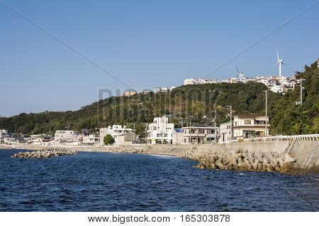 Seashore town scape and wind power plants in Awaji island