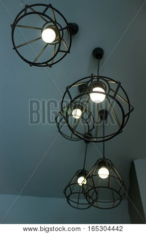 Vintage hanging light bulb over grey room stock photo