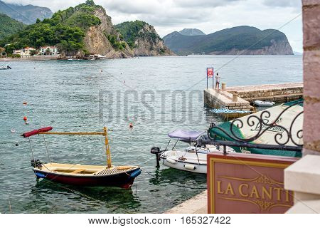 PETROVAC, MONTENEGRO - SEPTEMBER 20, 2016:Bay of Petrovac with boats and pier, Montenegro.