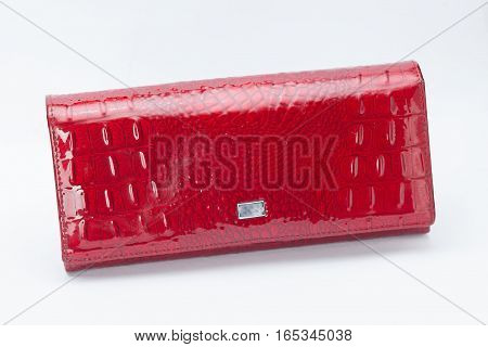 Red varnished wallet on the white background
