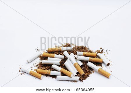 Brokern cigrettes and tobacco isolated on white background