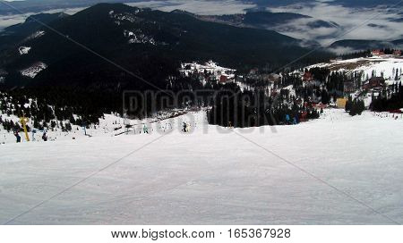 a lot of skiers on snowy the view from the top a beautiful landscape of the ski resort
