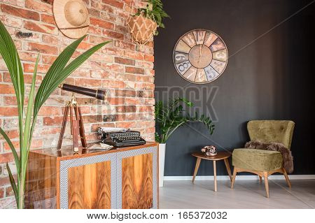 Room With Commode And Armchair