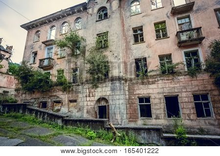 Abandoned mining ghost-town Jantuha, Abkhazia. Destroyed empty houses, the remains of the cars, remnant of The Georgian-Abkhazian war